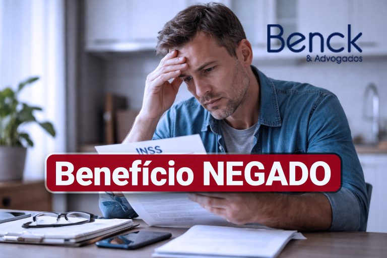 Pessoa preocupada após ter benefício negado pelo INSS analisando documento
